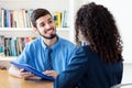 Laughing hispanic businessman at job interview