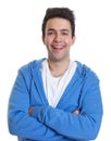 Laughing hispanic guy in a blue hoody Royalty Free Stock Photo