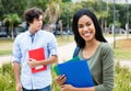 Laughing indian female student with caucasian male student Royalty Free Stock Photo