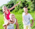 Laughing kids running on grass Royalty Free Stock Photo