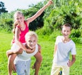 Laughing kids running on grass Royalty Free Stock Photo