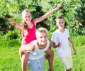 Laughing kids running on grass Royalty Free Stock Photo