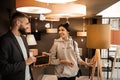 Laughing lady spending time in furniture store and choosing furniture