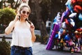 Laughing latin girl portrait, female teenager at smart phone outdoor in a colonial city in Mexico Royalty Free Stock Photo