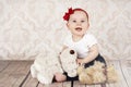 Laughing little baby girl with plush toys Royalty Free Stock Photo