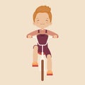 Laughing little boy riding a bicycle