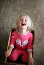 Laughing Little Child Playing in Large Cardboard Box at Home Royalty Free Stock Photo