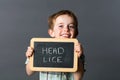 Laughing little child warning about head lice to fight against Royalty Free Stock Photo