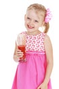 Laughing little girl with a glass of tomato juice Royalty Free Stock Photo