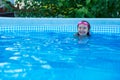 Laughing little girl in a swimming pool Royalty Free Stock Photo