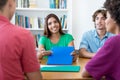 Laughing male and female students learning for test