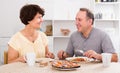 Laughing man and woman talking and having lunch Royalty Free Stock Photo