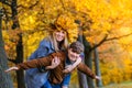 Laughing Man and woman with a wreath of autumn yellow leaves on her head