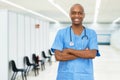 Laughing mature adult african american male nurse at vaccination station for vacinating patients Royalty Free Stock Photo