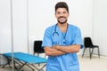 Laughing mexican male doctor is ready for vacinating patients