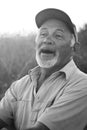 Laughing middle-aged man in a baseball cap