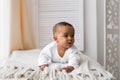 Laughing Mixed Race Baby Boy Lying On Tummy At Home Royalty Free Stock Photo