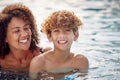 Laughing Mother And Son Having Fun In Swimming Pool On Summer Vacation Royalty Free Stock Photo