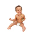 Laughing mulatto black baby wearing a beads