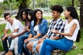 Native latin american woman and african man talking with caucasian friends outdoor in the summer in the city Royalty Free Stock Photo