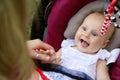 Laughing Newborn Baby Girl in Car Seat Royalty Free Stock Photo