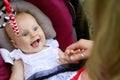 Laughing Newborn Baby Girl in Car Seat Royalty Free Stock Photo