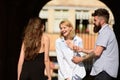 Laughing out loud. People enjoying each others company. Bearded man and pretty women smiling on street. Boyfriend dating