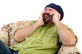 Laughing overweight man in chair with mobile