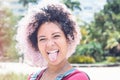 Laughing punk girl with pink hair showing tongue Royalty Free Stock Photo