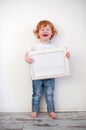 Laughing redhead boy with a frame