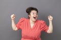 Laughing 20s big woman expressing fun success