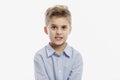 Laughing school boy in a blue shirt. Isolated over white background Royalty Free Stock Photo