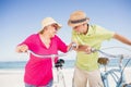 Laughing senior couple going for a bike ride Royalty Free Stock Photo