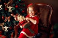 Laughing small girl with decorative Santa Royalty Free Stock Photo
