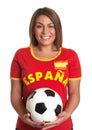 Laughing spanish girl with football