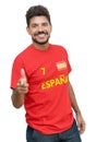 Laughing spanish soccer fan with beard and red jersey Royalty Free Stock Photo