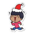 laughing sticker cartoon of a man wearing santa hat