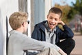 Laughing teen with braces beside friend Royalty Free Stock Photo