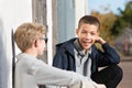 Laughing teen with braces outside with friend Royalty Free Stock Photo