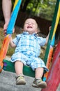 Laughing toddler boy riding Royalty Free Stock Photo