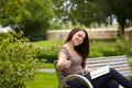 Laughing woman with book posing thumbs up Royalty Free Stock Photo