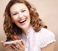 Laughing woman with cake