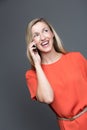 Laughing woman chatting on her mobile phone Royalty Free Stock Photo