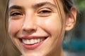 Laughing woman closeup. Portrait of happy smiling girl. Cheerful young beautiful girl smiling laughing outdoor. Royalty Free Stock Photo