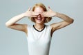 Laughing woman closing her eyes with hands Royalty Free Stock Photo