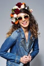 Laughing woman in flower crown wearing sunglasses Royalty Free Stock Photo
