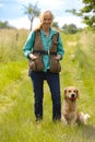 Laughing woman with golden retriever Royalty Free Stock Photo