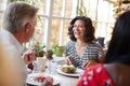 Laughing woman laughing with male friend at a cafe, close up Royalty Free Stock Photo