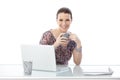 Laughing woman at office desk