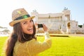 Laughing woman taking photo of Venice Square monument Royalty Free Stock Photo